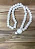 ITEM 56556 - 20"L WHITE WOOD BEADS WITH TASSEL