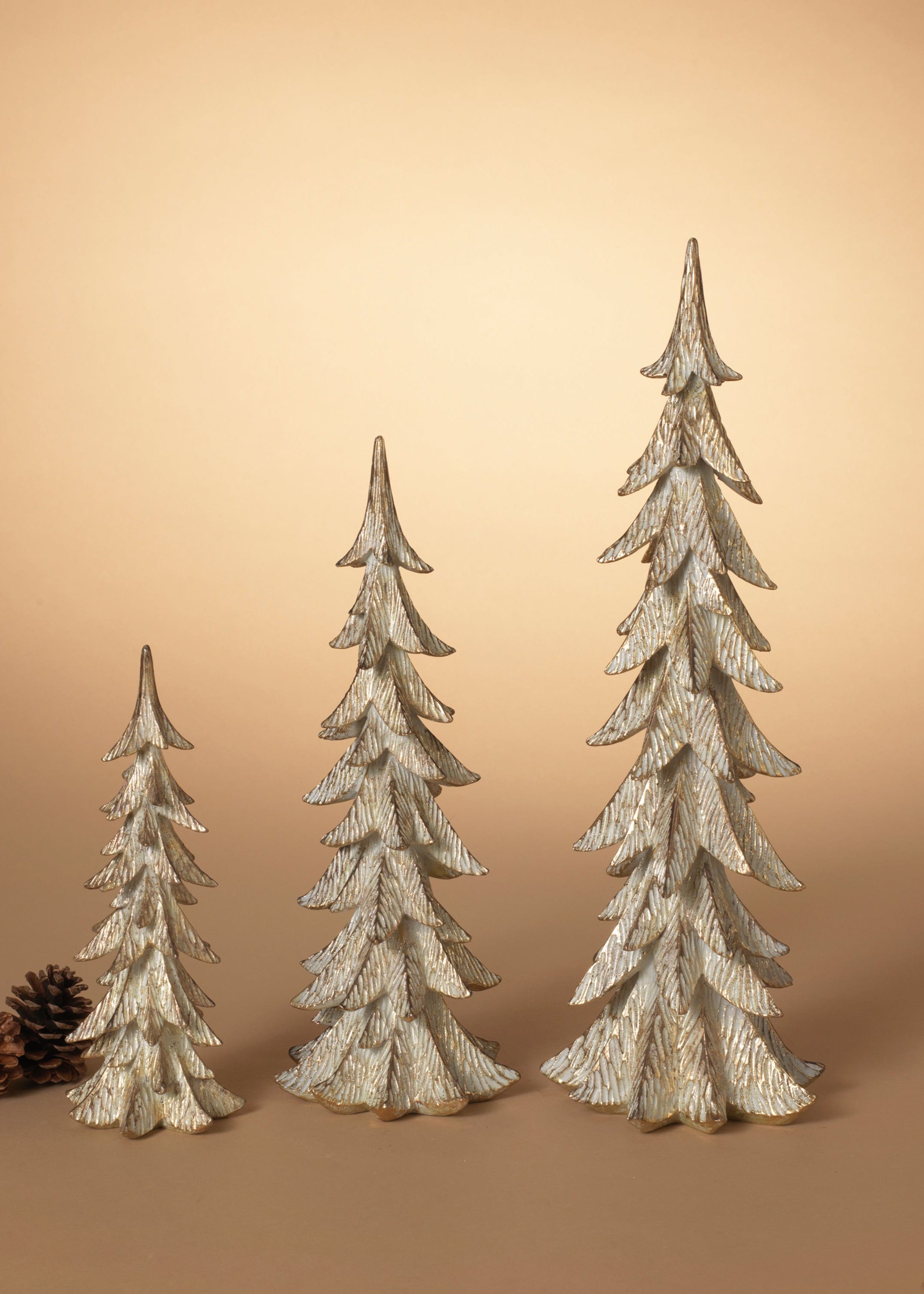 ITEM G2657370 - CHAMPAGNE RESIN HOLIDAY CHRISTMAS TREES - SET OF 3