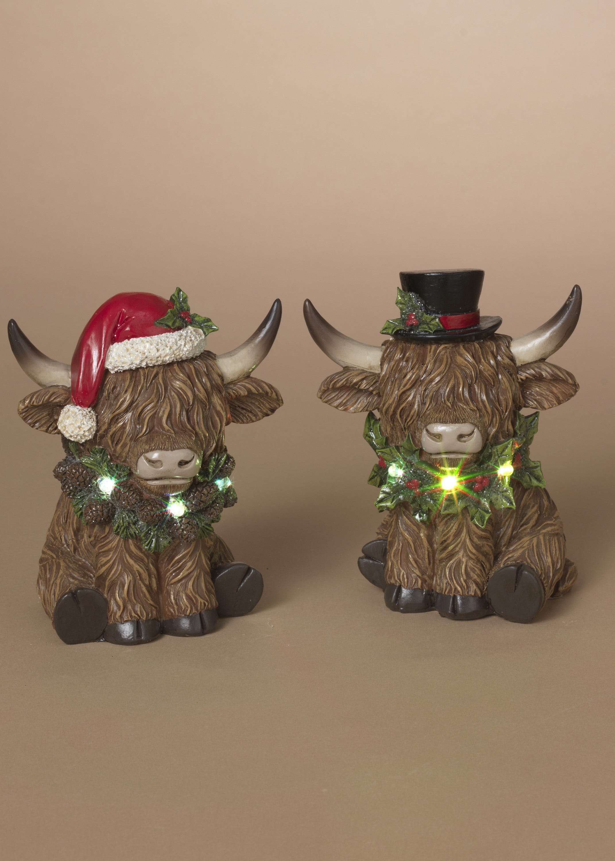 ITEM G2795010 - 5.5"H B/O LIGHTED RESIN HOLIDAY HIGHLAND COW