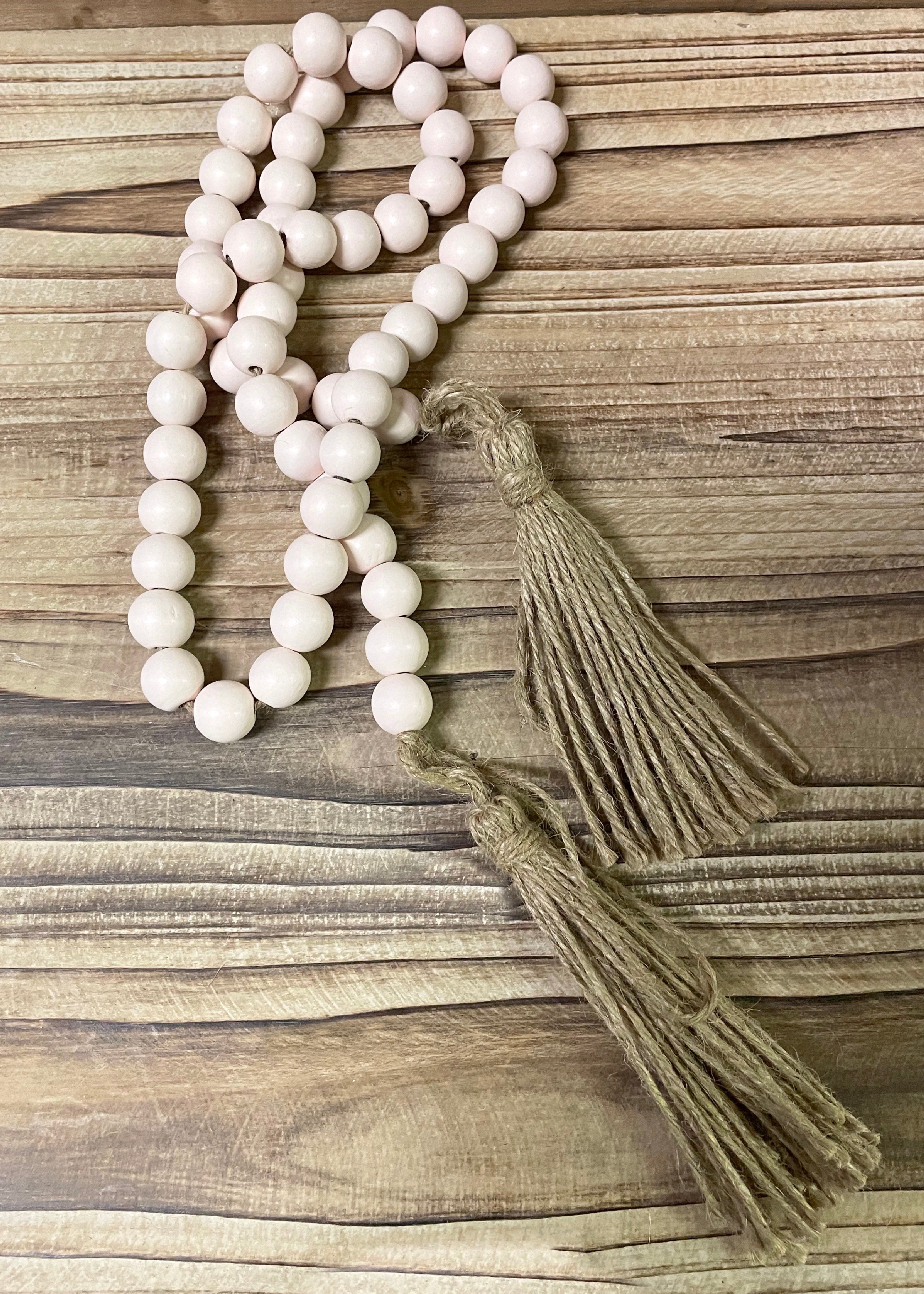 ITEM 56159 - 46"L WHITE WOOD BEAD GARLAND WITH TASSELS