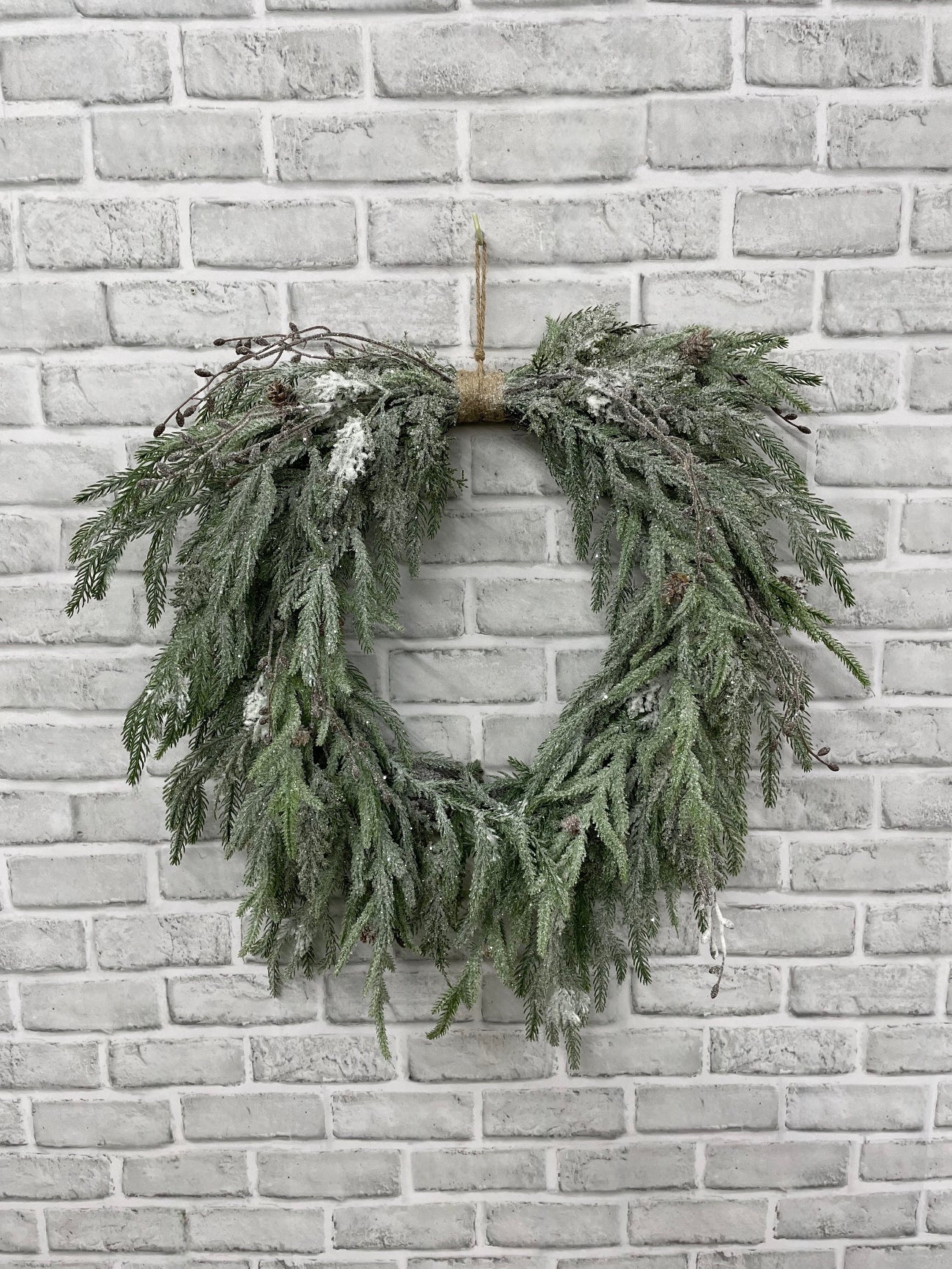 ITEM 82212 - 12" INSIDE DIM, 23" OUTSIDE DIM, 26"L FROM TOP OF HANGER TO BOTTOM OF WREATH FRESH TOUCH SNOWY PINE HEART SHAPE WREATH