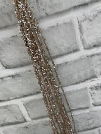 ITEM 82242 CH - 24" CHAMPAGNE TINSEL SPRAY