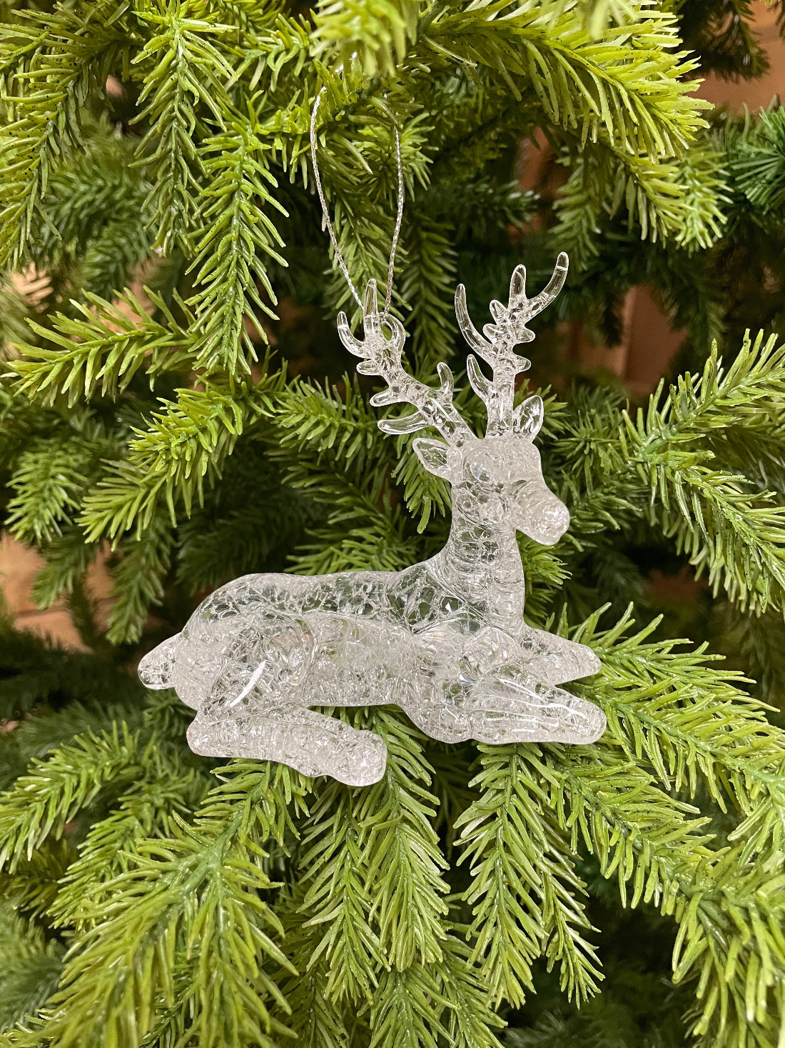 ITEM 82262 - 4" X 2" X 2.5" ACRYLIC HANGING LYING DOWN REINDEER ORNAMENT