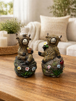 ITEM FC2048 - 5.25"X 4.25" X 7.75" POLYRESIN FIGURINE (YAK SITTING ON ROCK) - 2 ASSORTED