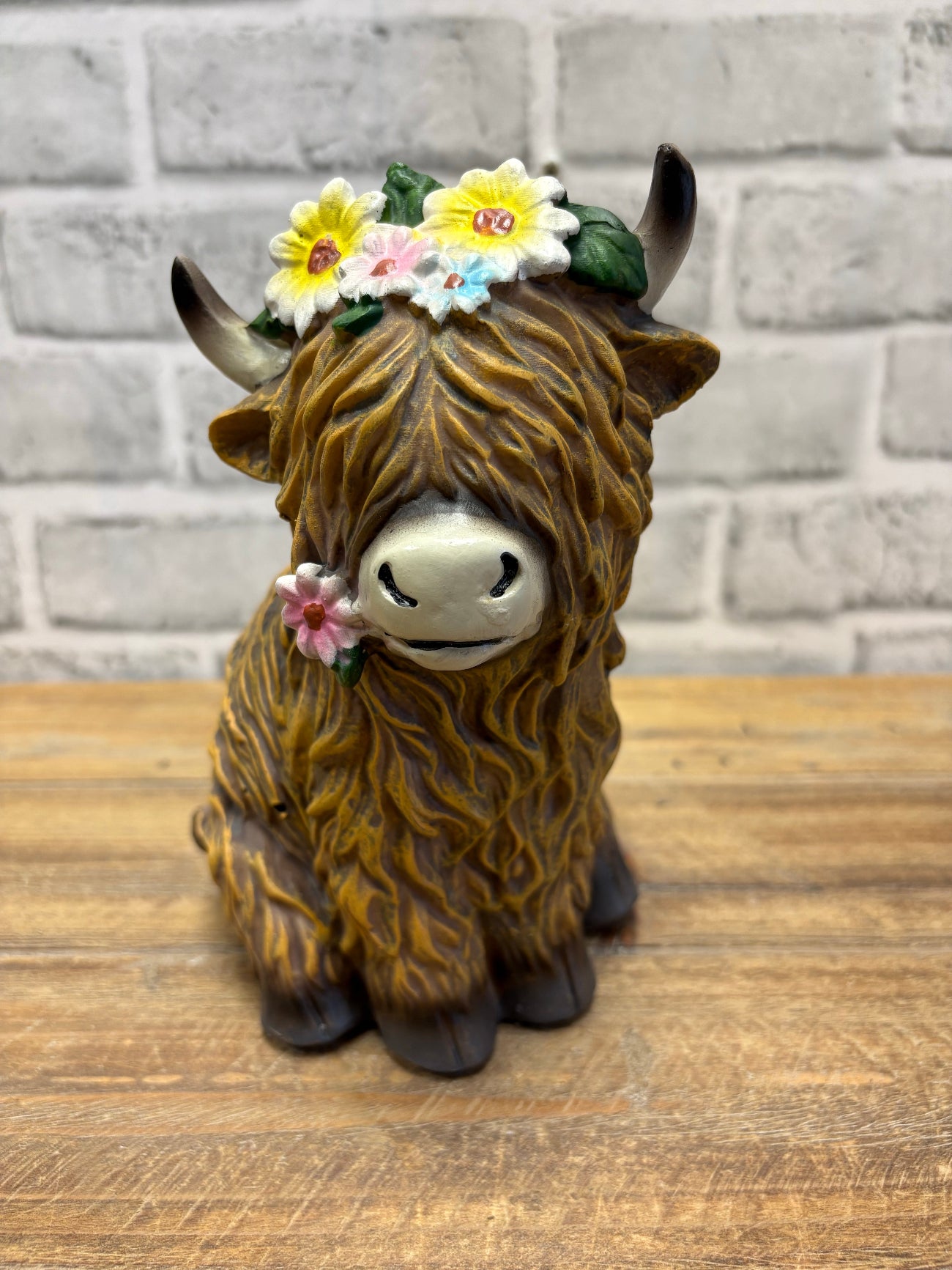 ITEM FC2049 - 6"X 4.5" X 7.75" POLYRESIN FIGURINE (YAK WITH FLOWER CROWN)