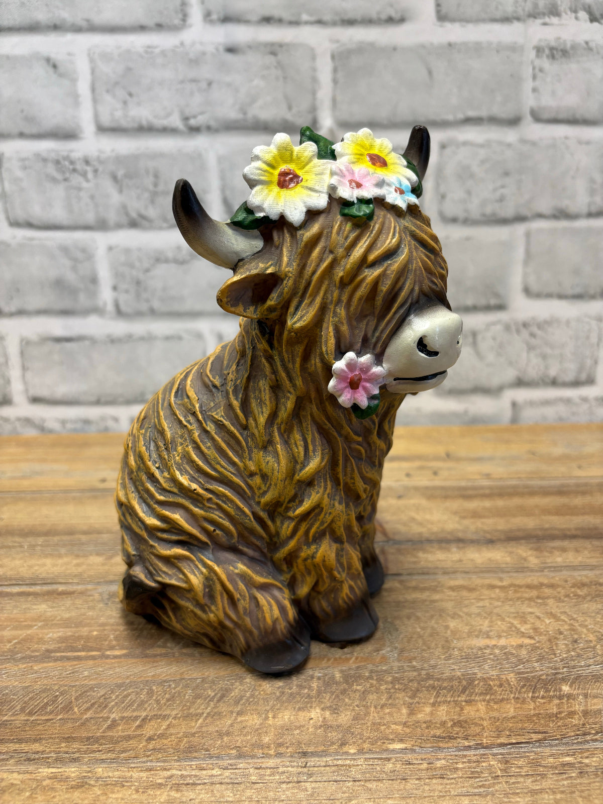 ITEM FC2049 - 6"X 4.5" X 7.75" POLYRESIN FIGURINE (YAK WITH FLOWER CROWN)