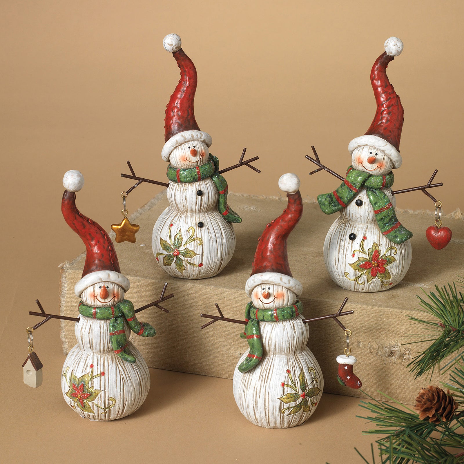 ITEM G2007110 - 6"H RESIN WOOD LIKE HOLIDAY SNOWMAN FIGURINE WITH MINI ORNAMENTS HANGING FROM BRANCH ARMS - 4 ASSORTED