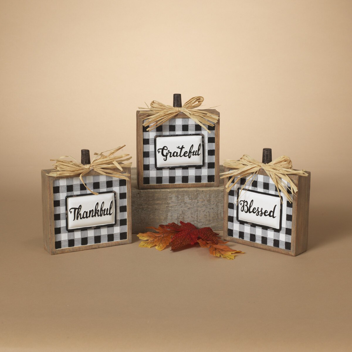 ITEM G2589190 - 6.5"H RESIN PLAID SQUARE PUMPKIN WITH RAFFIA BOW - 3 ASSORTED