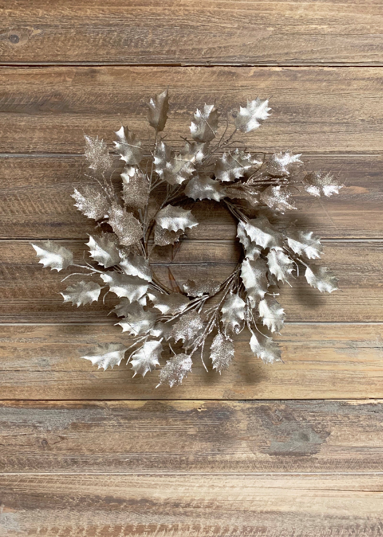 ITEM 81569 CH - 12" DIA METALLIC GLITTERED CHAMPAGNE PLASTIC HOLLY LEAF WREATH